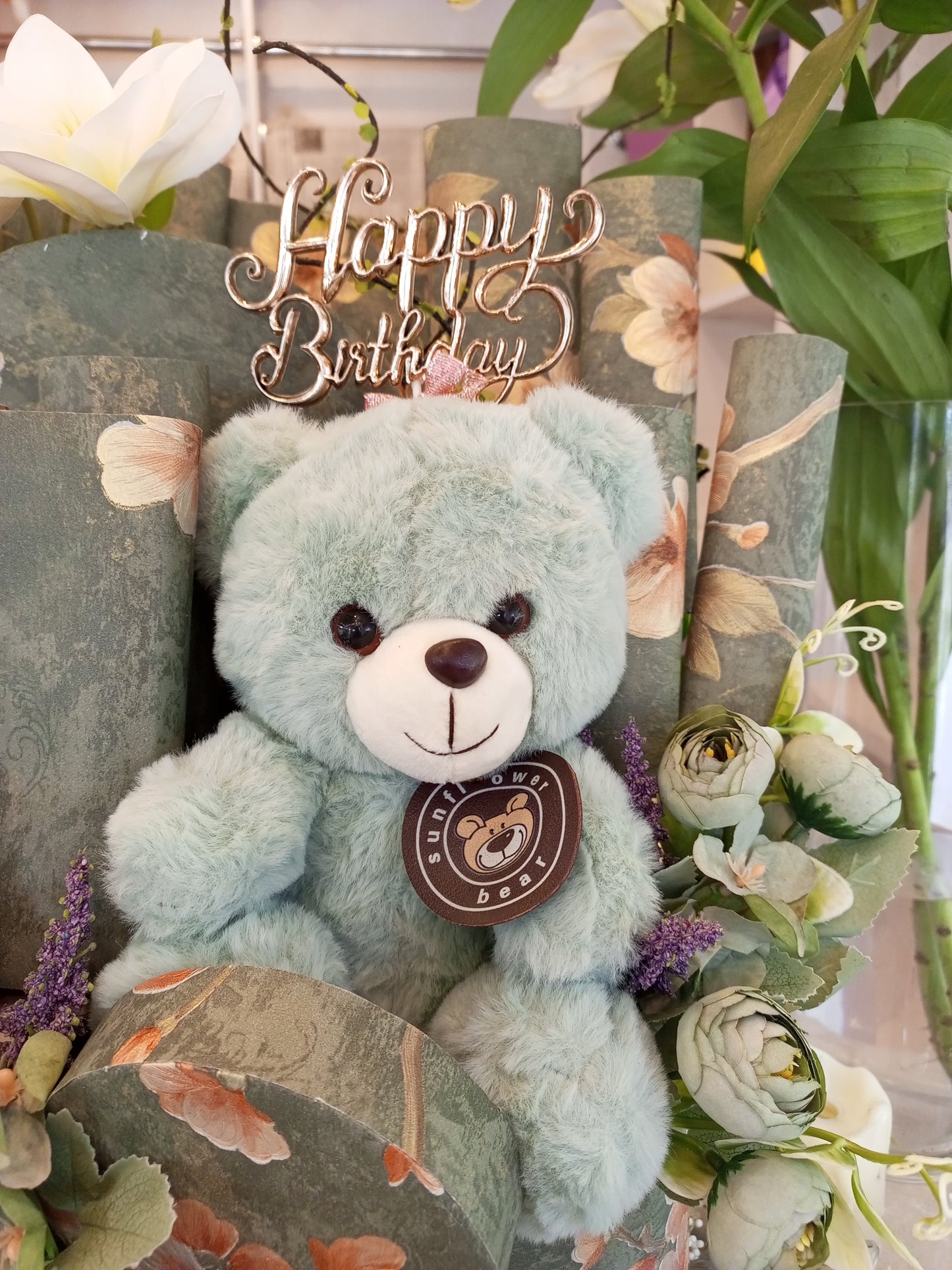 Green Chocolate Gift Basket with Teddy Bear, Fragrance Candle, Sparrows & Artificial Lily